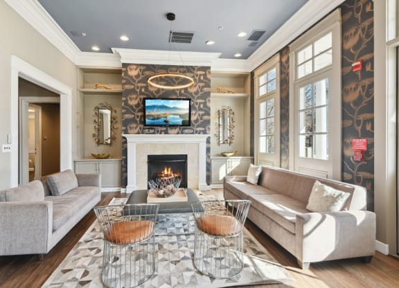 a living room with a fireplace and a tv above it