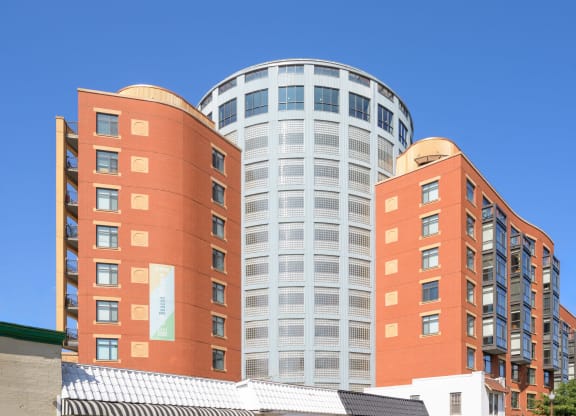 a city building with a blue sky in the background