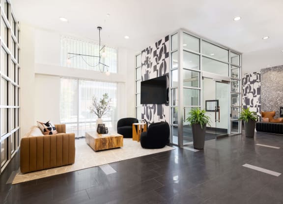 a living room with couches and a tv