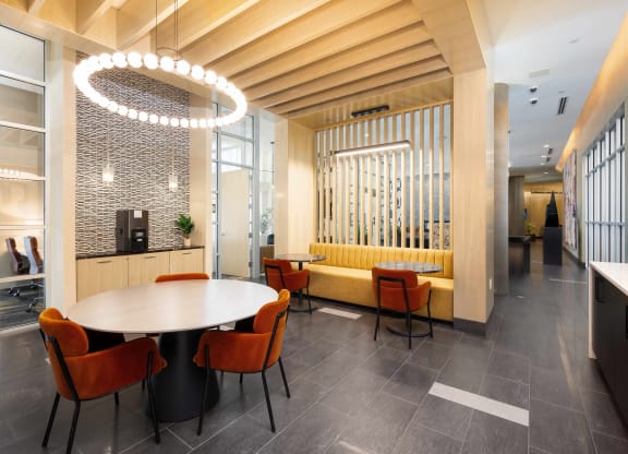a dining room with a table and chairs