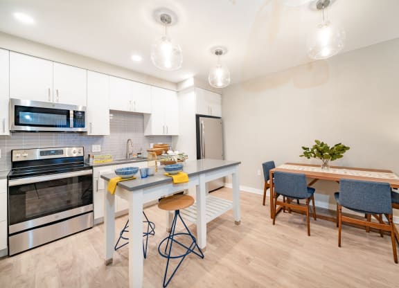 Apartment kitchen with island and dining table