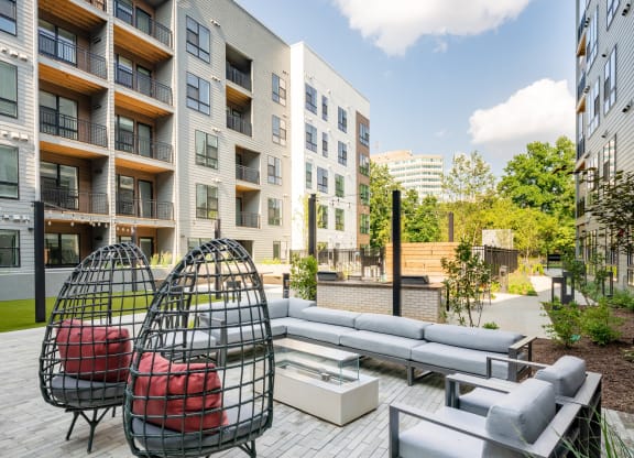 Outdoor patio with hammock chairs.