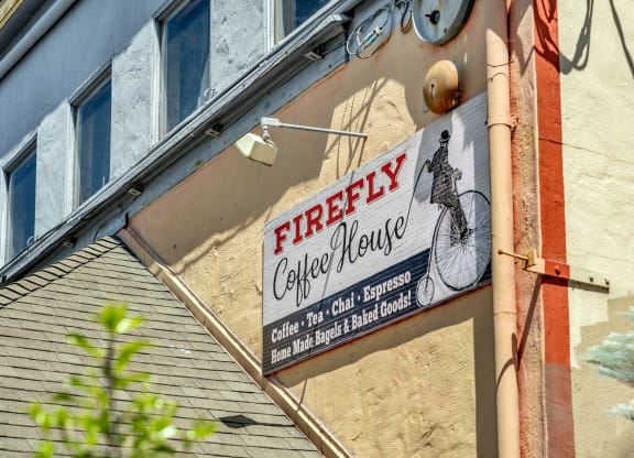 a sign for a coffee house on the side of a building