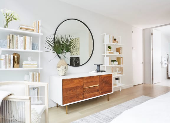 Decorated living room with bookcases and storage