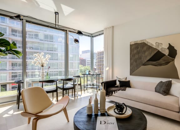 Apartment living room lined with floor-to-ceiling windows