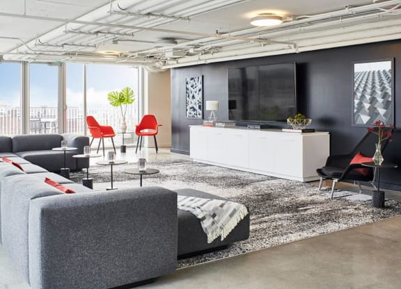 a living room with couches and a tv