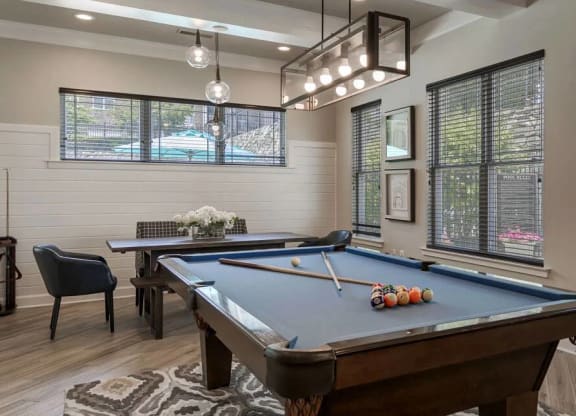 Game Lounge with a billiards table and large windows letting in the natural light at Chesapeake Ridge, North East, Maryland