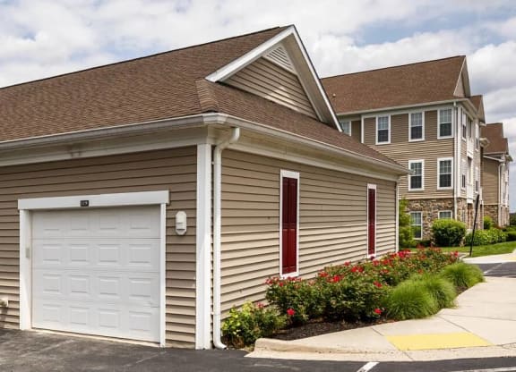 On Site Garage Parking with white doors at Chesapeake Ridge, Maryland, 21901
