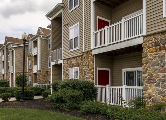 Property Building view with half stone walls and large sectioned windows at Chesapeake Ridge, Maryland