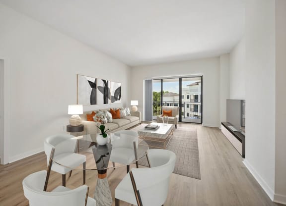 a living room with a couch and a glass table