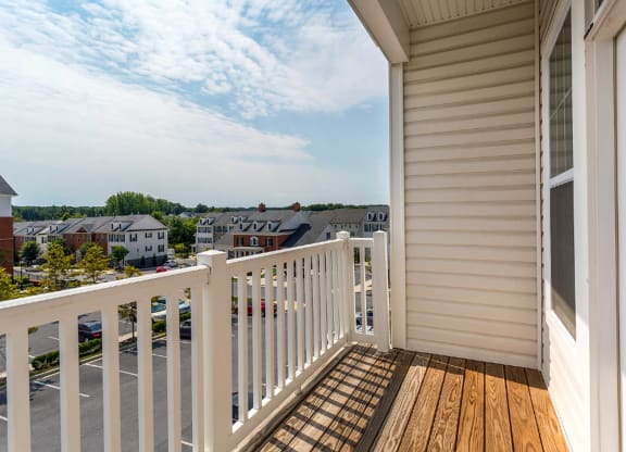 a balcony with a view of the city and the horizon in the distance