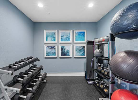 gym with weight machines and strength equipment