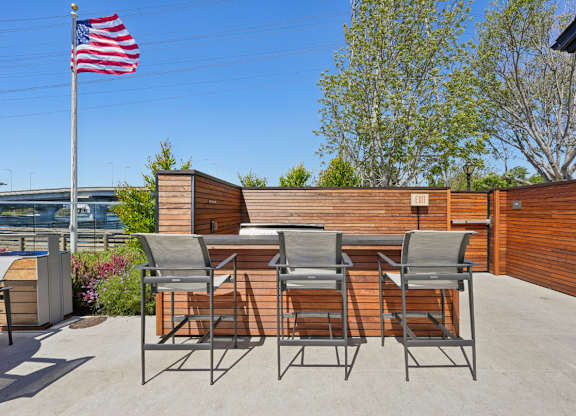 grill area with seating and waterfront views