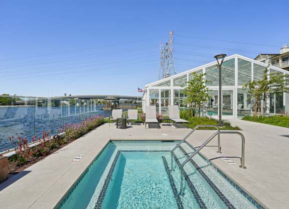 Hot tub and pool area at Marlin Cove Apartments overlooking the waterfront in Foster City.