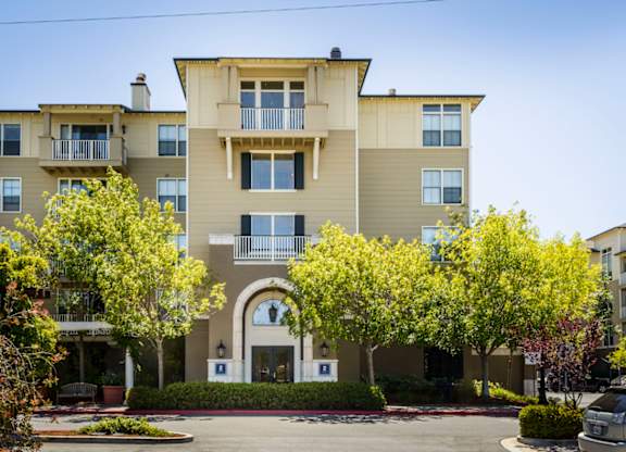 apartment building exterior with landscaping