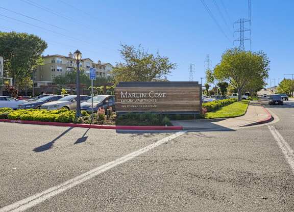 Entrance sign for Marlin Cove Luxury Apartments in Foster City, California.