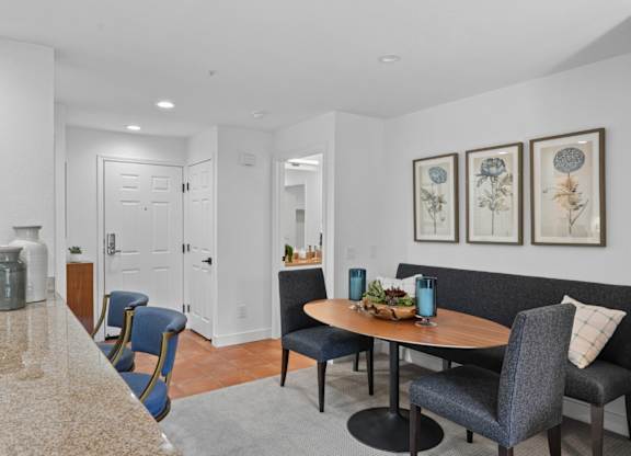 apartment dining area with table and chairs