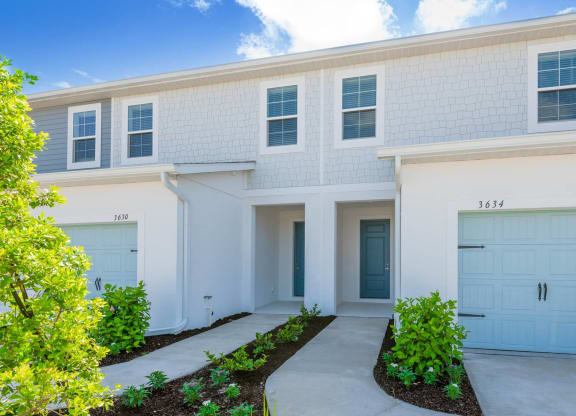 a white house with blue doors