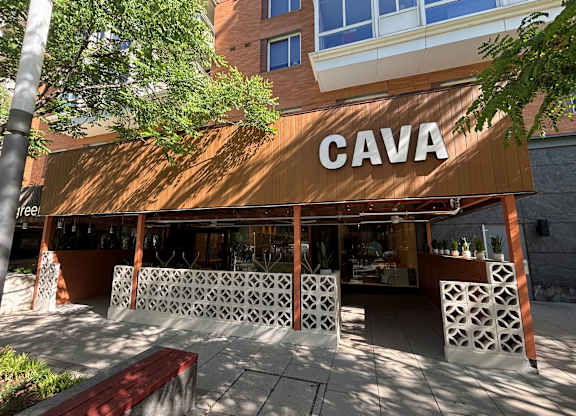 A building with a brown awning and the word