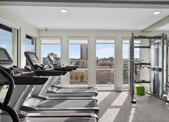 Modern apartment fitness center with cardio and strength equipment in Denver.