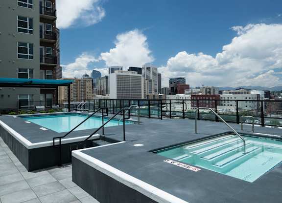 Pool with views of the Denver skyline.