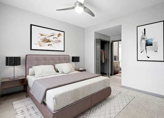 Apartment bedroom designed for relaxation with natural light and modern accents.