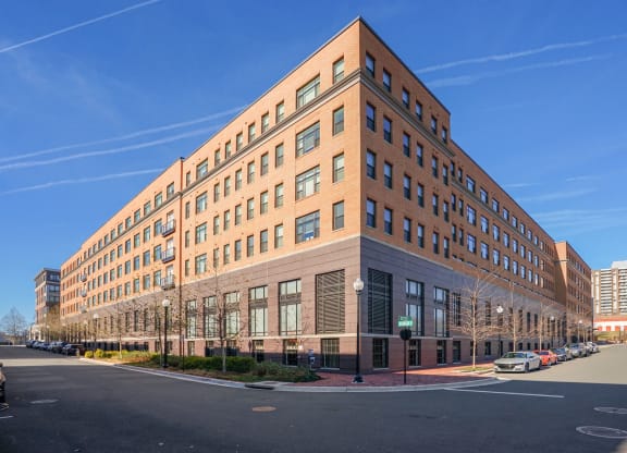 A pale red building in the blue sky