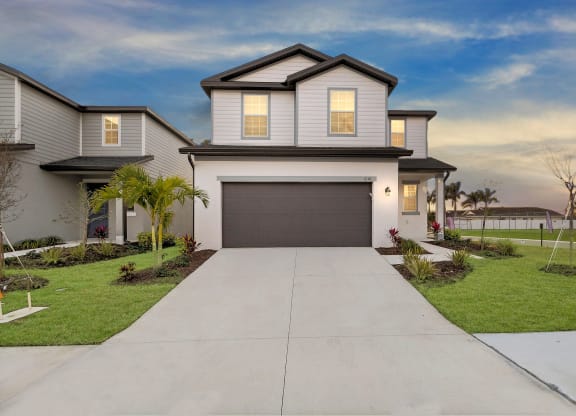 a home with a gray garage door