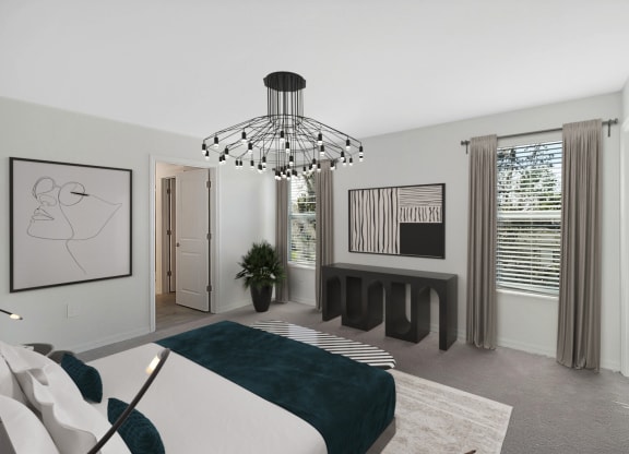 a bedroom with a large bed and a large chandelier