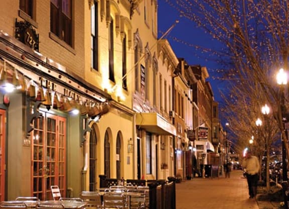 a city street with tables and chairs on it