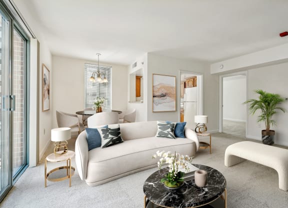 a living room with a white couch and a round table