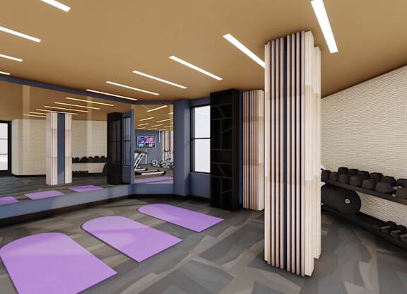 A modern room with purple mats on the floor and a row of black chairs.