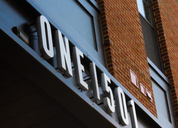 a neon sign on the side of a building