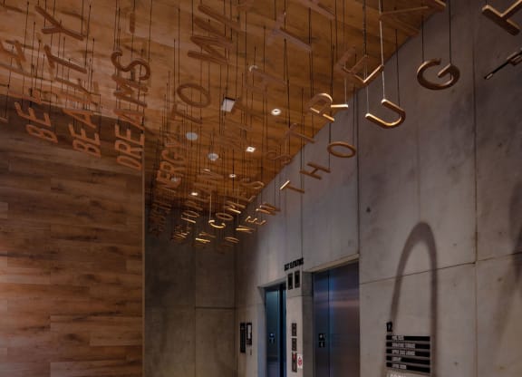 a hallway with wooden ceilings and a blue door