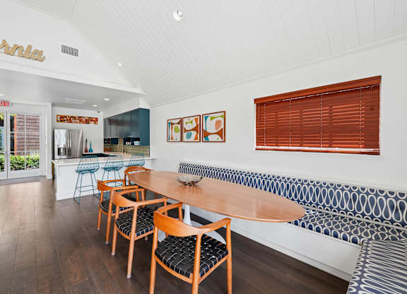 Resident clubhouse at Sunnyvale apartment community with large windows and seating