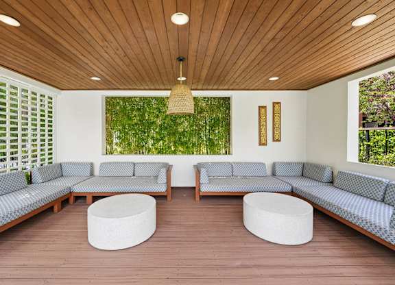 Poolside landscaping at Grove Apartments with trees and planted areas