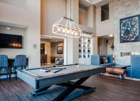our apartments showcase a clubhouse with a pool table