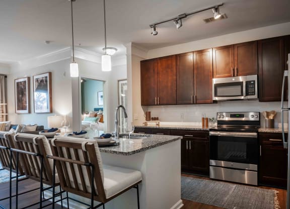 a kitchen and living room in a 555 waverly unit