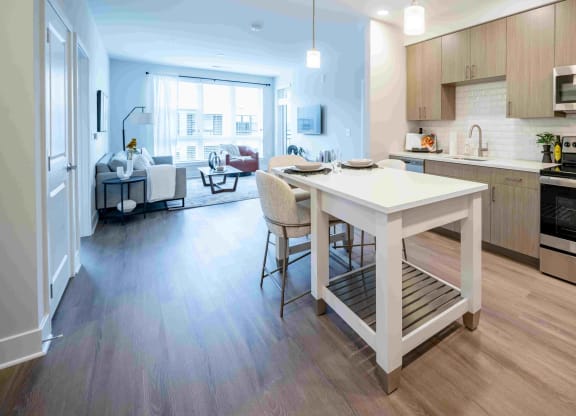 a kitchen with a white island in the middle