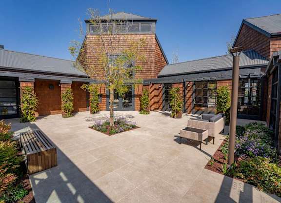 Pool house exterior with landscaped surroundings