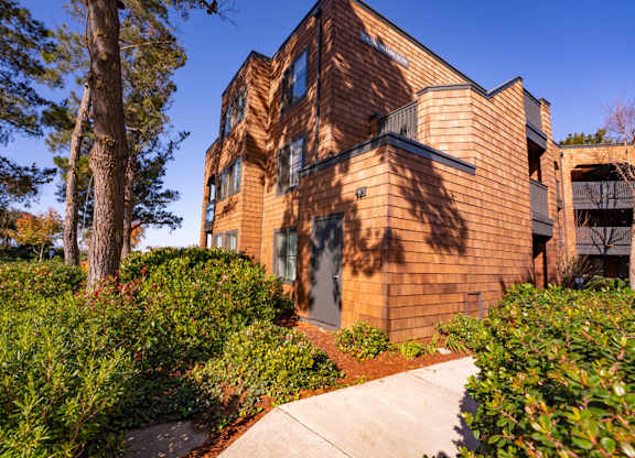 Apartment grounds with lush greenery and landscaped paths at Indian Creek in Redwood City