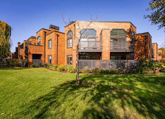 Apartment grounds with lush greenery and landscaped paths at Indian Creek in Redwood City
