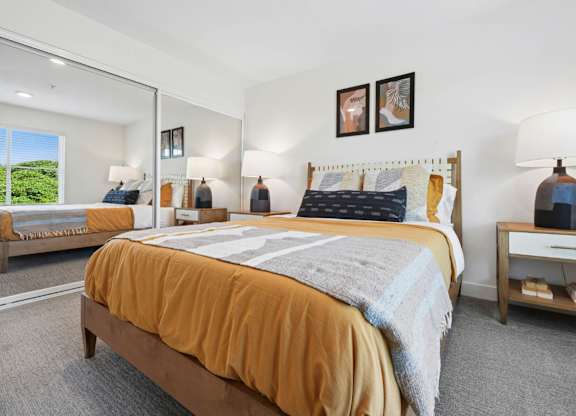 Apartment bedroom designed for relaxation with natural light and modern accents