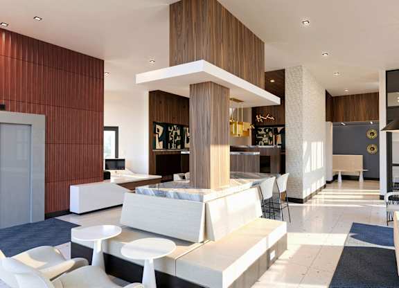 A modern living room with a white sofa set and a wooden accent wall.