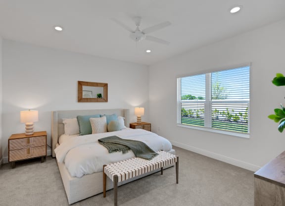 a bedroom with a bed and a ceiling fan at Marisol, Bradenton Florida 34211