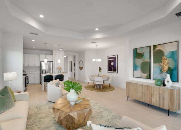 a living room with couches and chairs and a table at Marisol, Bradenton Florida