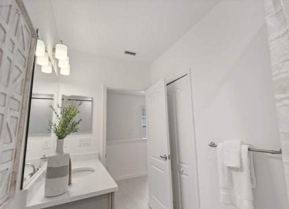 Upstairs bathroom sink vanity in three bedroom home at Martinique