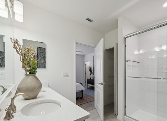 Bathroom with sink and walk-in shower in 3-bedroom model home