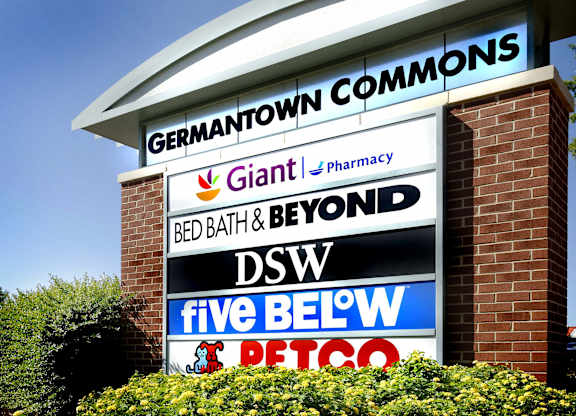 A sign for Germantown Commons with various businesses listed.