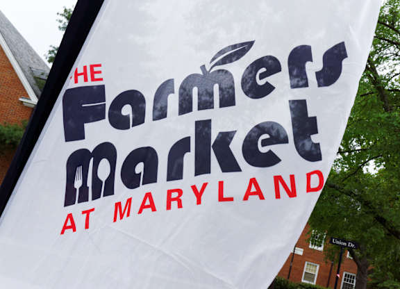 A white banner with black and red text that says